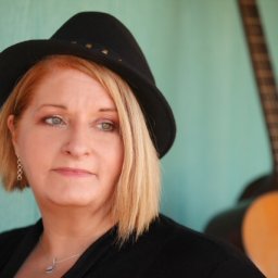 Sandy Hathaway with guitar